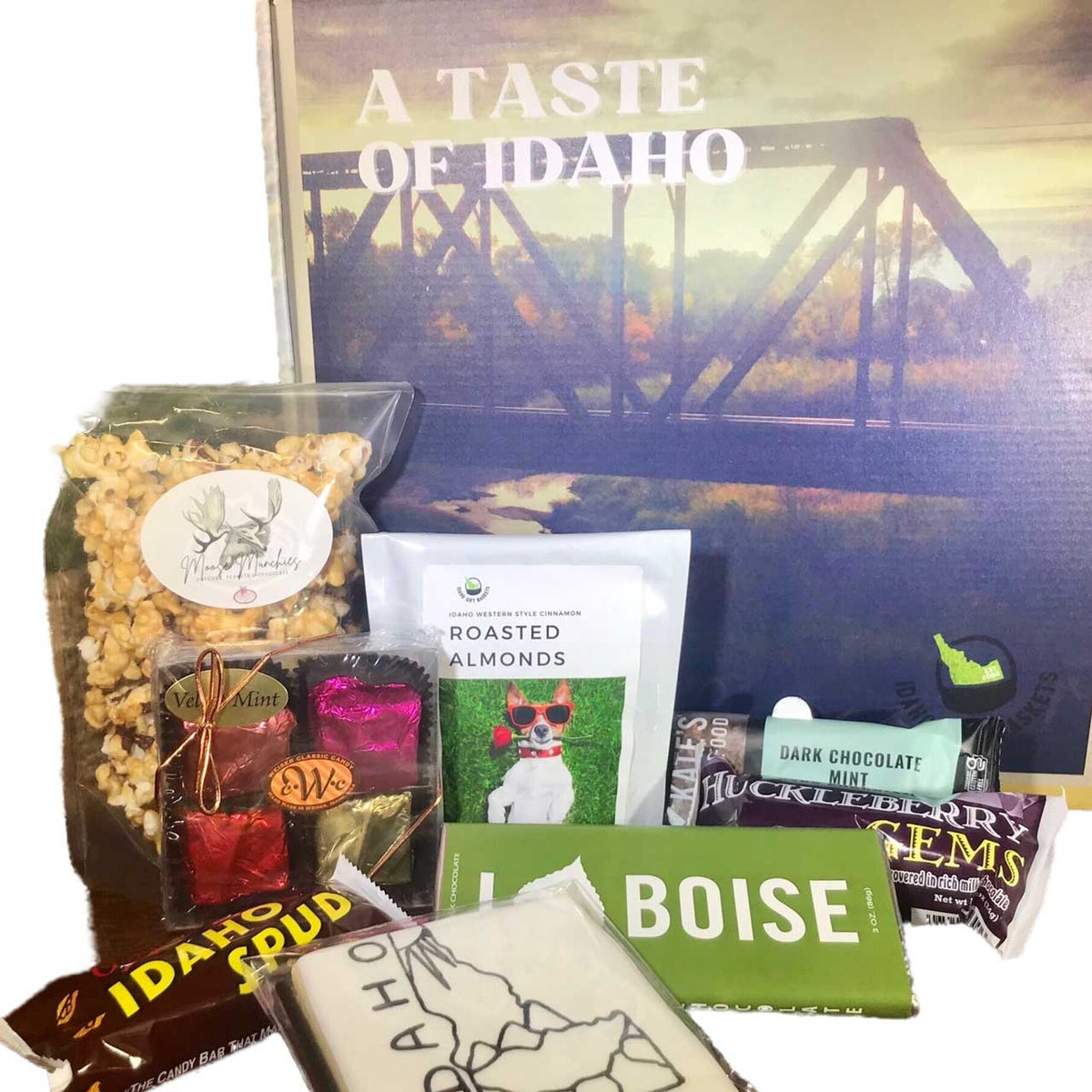 https://www.idahogiftbaskets.net/cdn/shop/products/A-Taste-of-Idaho-Snack-Box-Designers-Choice-02-Idaho-Gift-Baskets_1200x.jpg?v=1649107874